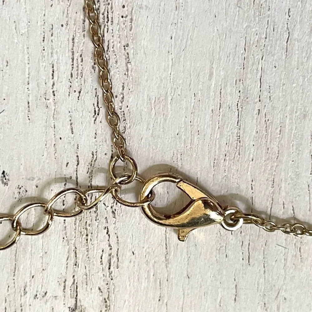 Gold tone pendant necklace